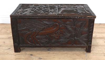 Lot 212 - A carved African coffer