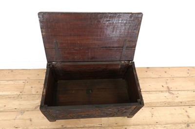 Lot 212 - A carved African coffer