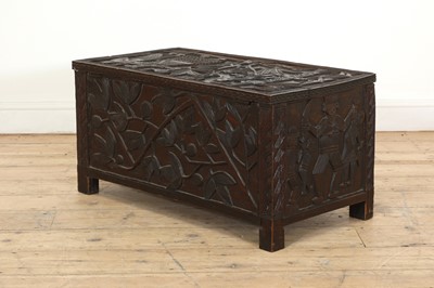 Lot 212 - A carved African coffer