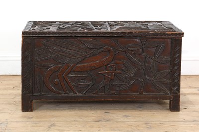 Lot 212 - A carved African coffer