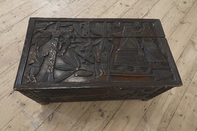 Lot 212 - A carved African coffer
