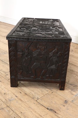 Lot 212 - A carved African coffer