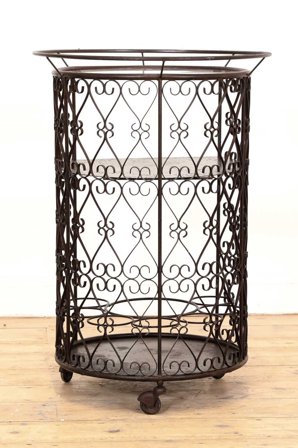 Lot 280 - A patinated metal bar cart