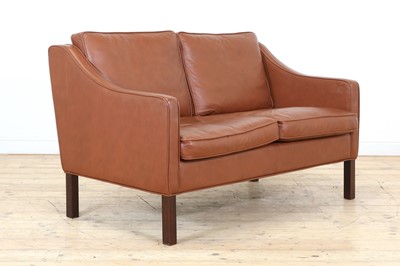 Lot 323 - A Danish brown leather two-seater settee