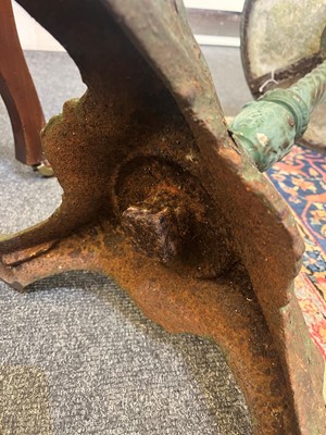 Lot 398 - A painted cast iron garden table