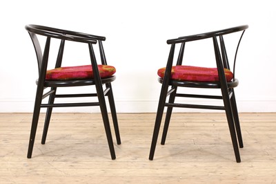 Lot 259 - A pair of Scandinavian ebonised armchairs