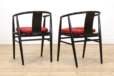 Lot 259 - A pair of Scandinavian ebonised armchairs