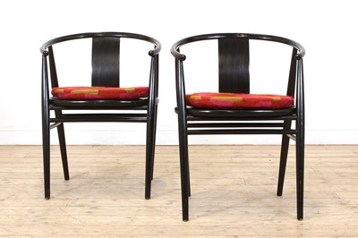 Lot 259 - A pair of Scandinavian ebonised armchairs