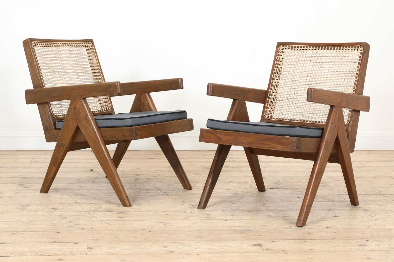 Lot 208 - A pair of teak 'Low Easy Chair' armchairs