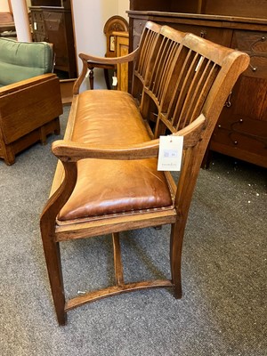 Lot 33 - A Cotswold School oak chair-back settee
