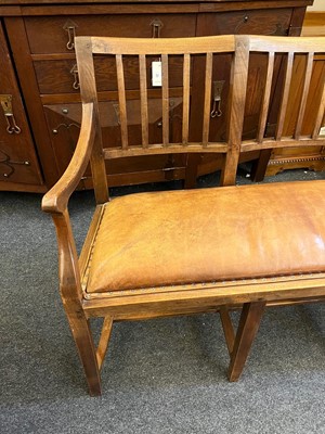 Lot 33 - A Cotswold School oak chair-back settee