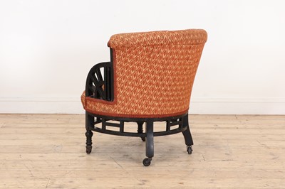 Lot 11 - An ebonised armchair