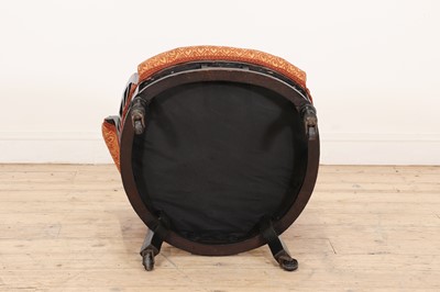 Lot 11 - An ebonised armchair