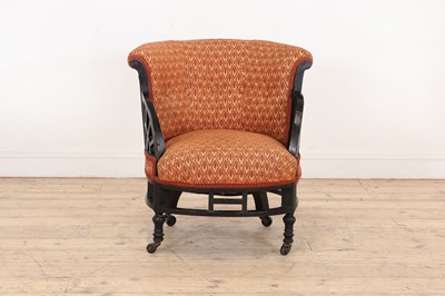 Lot 11 - An ebonised armchair