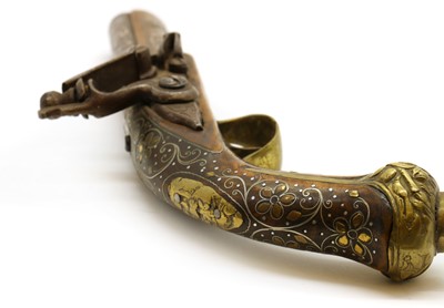 Lot 93 - A silver inlaid flintlock pistol