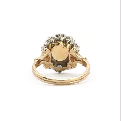 Lot 145 - A 9ct white gold opal and diamond cluster ring