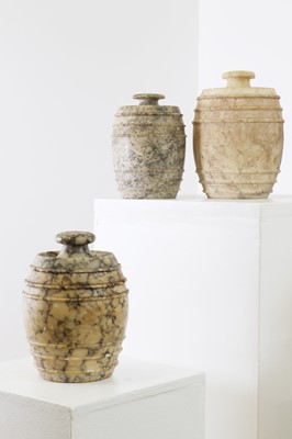 Lot 517 - Five carved alabaster jars and covers