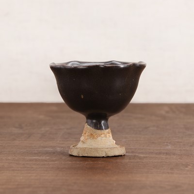 Lot 17 - A Chinese stoneware stem cup