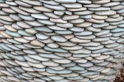 Lot 510 - A pair of pebble stone garden planters