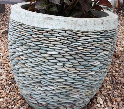 Lot 510 - A pair of pebble stone garden planters
