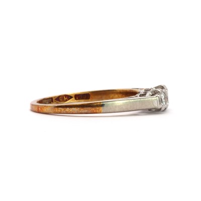 Lot 55 - A gold three stone diamond ring