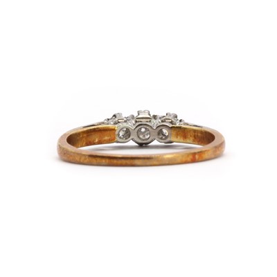 Lot 55 - A gold three stone diamond ring