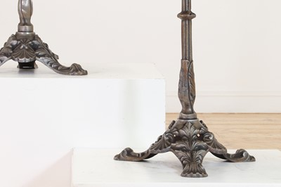 Lot 276 - A pair of marble and polished cast iron bistro tables