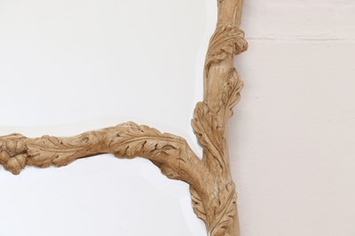 Lot 83 - A carved wooden mirror in the Black Forest style