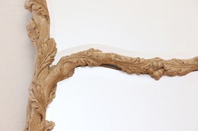 Lot 83 - A carved wooden mirror in the Black Forest style