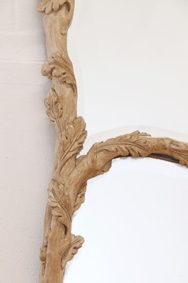 Lot 83 - A carved wooden mirror in the Black Forest style