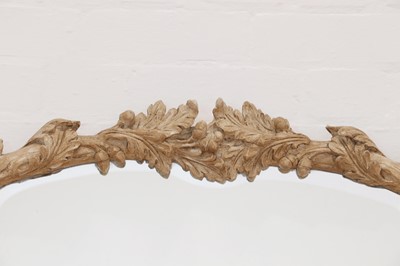 Lot 83 - A carved wooden mirror in the Black Forest style