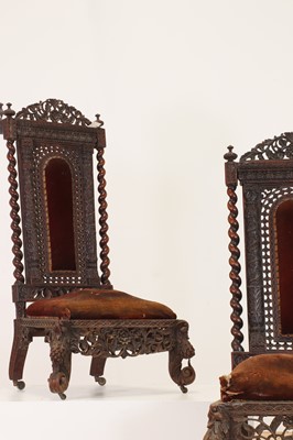Lot 147 - A near pair of carved rosewood occasional chairs