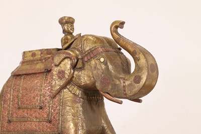 Lot 140 - A large copper and brass-clad pull-along elephant