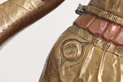 Lot 140 - A large copper and brass-clad pull-along elephant