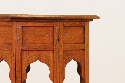 Lot 134 - A teak and brass octagonal occasional table