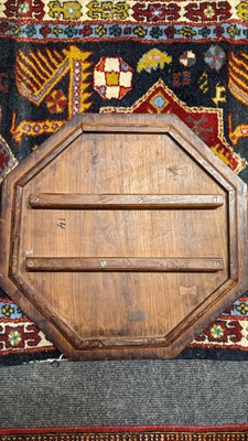 Lot 134 - A teak and brass octagonal occasional table