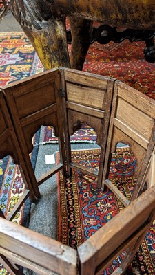 Lot 134 - A teak and brass octagonal occasional table