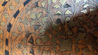 Lot 134 - A teak and brass octagonal occasional table