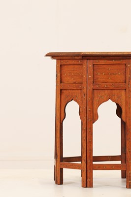 Lot 134 - A teak and brass octagonal occasional table