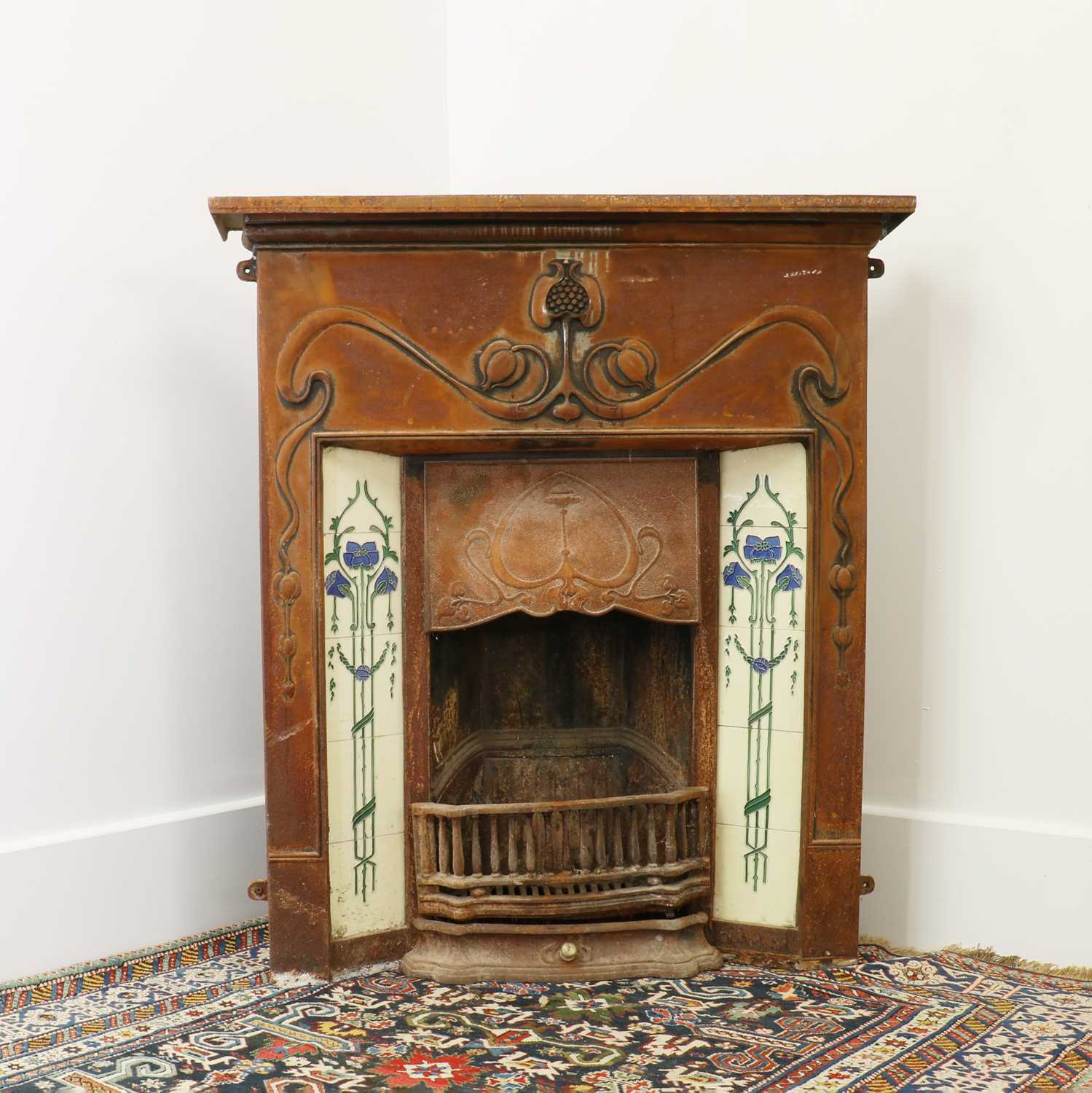 Lot 5 - An Art Nouveau cast iron fire surround