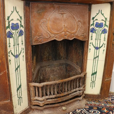 Lot 5 - An Art Nouveau cast iron fire surround