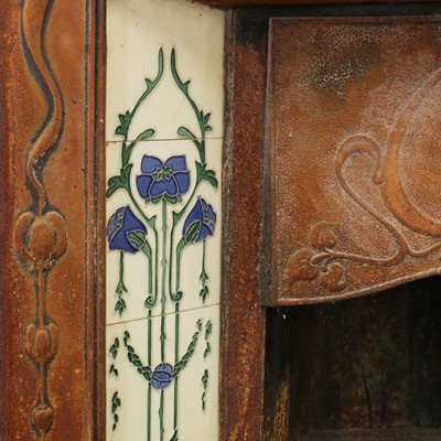 Lot 5 - An Art Nouveau cast iron fire surround