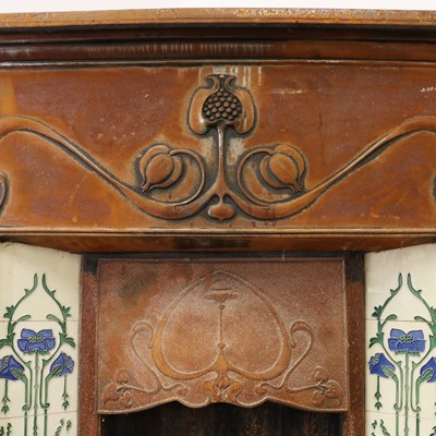 Lot 5 - An Art Nouveau cast iron fire surround