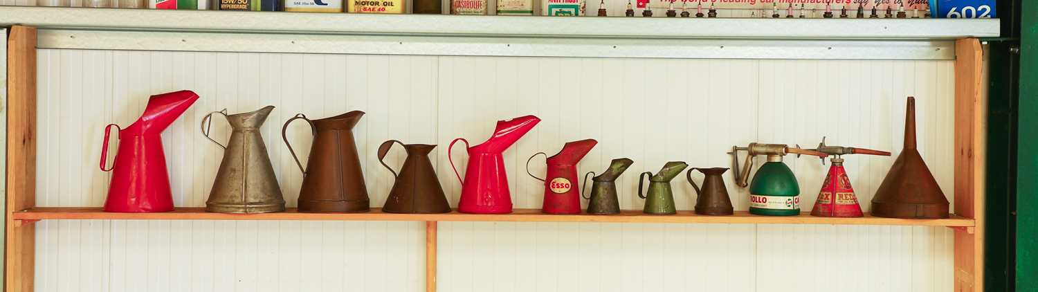 Lot 11 - Various pre-war copper, aluminium and liveried tin oil jugs