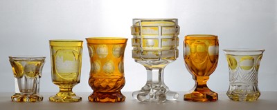Lot 216 - A group of six Bohemian amber flashed glass spa beakers