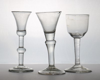 Lot 182 - A group of three plain stem wine glasses