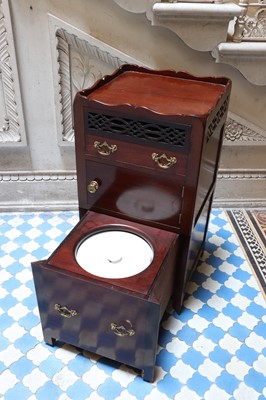 Lot 174 - ☘ A mahogany tray-top night table