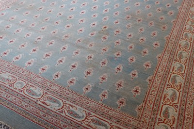 Lot 103 - ☘ A large blue Amritsar carpet