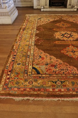 Lot 102 - ☘ A Kurdish wool carpet