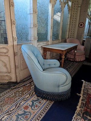 Lot 15 - A button-upholstered spoon-back armchair